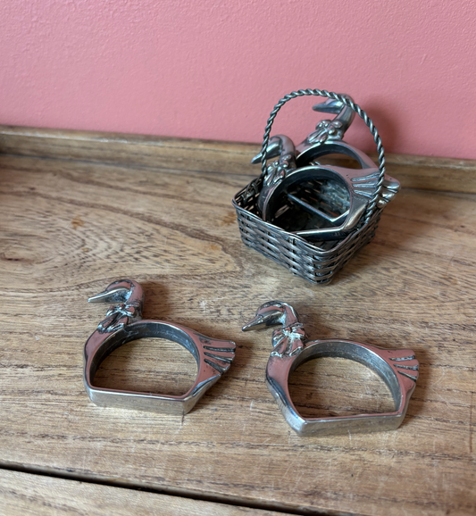 Set of 4 Silver Plate Good Napkin Rings in basket