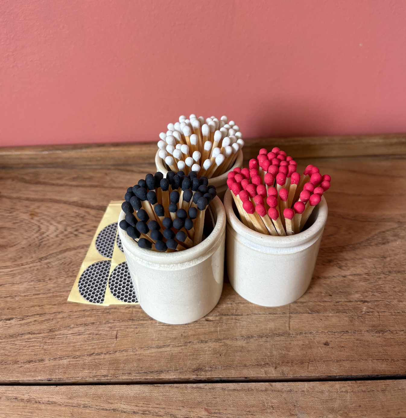 Beige Ceramic Pot with colourful Matches