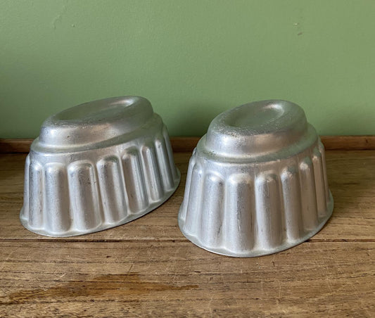 Two Oval Ribbed Aluminium Jelly Moulds