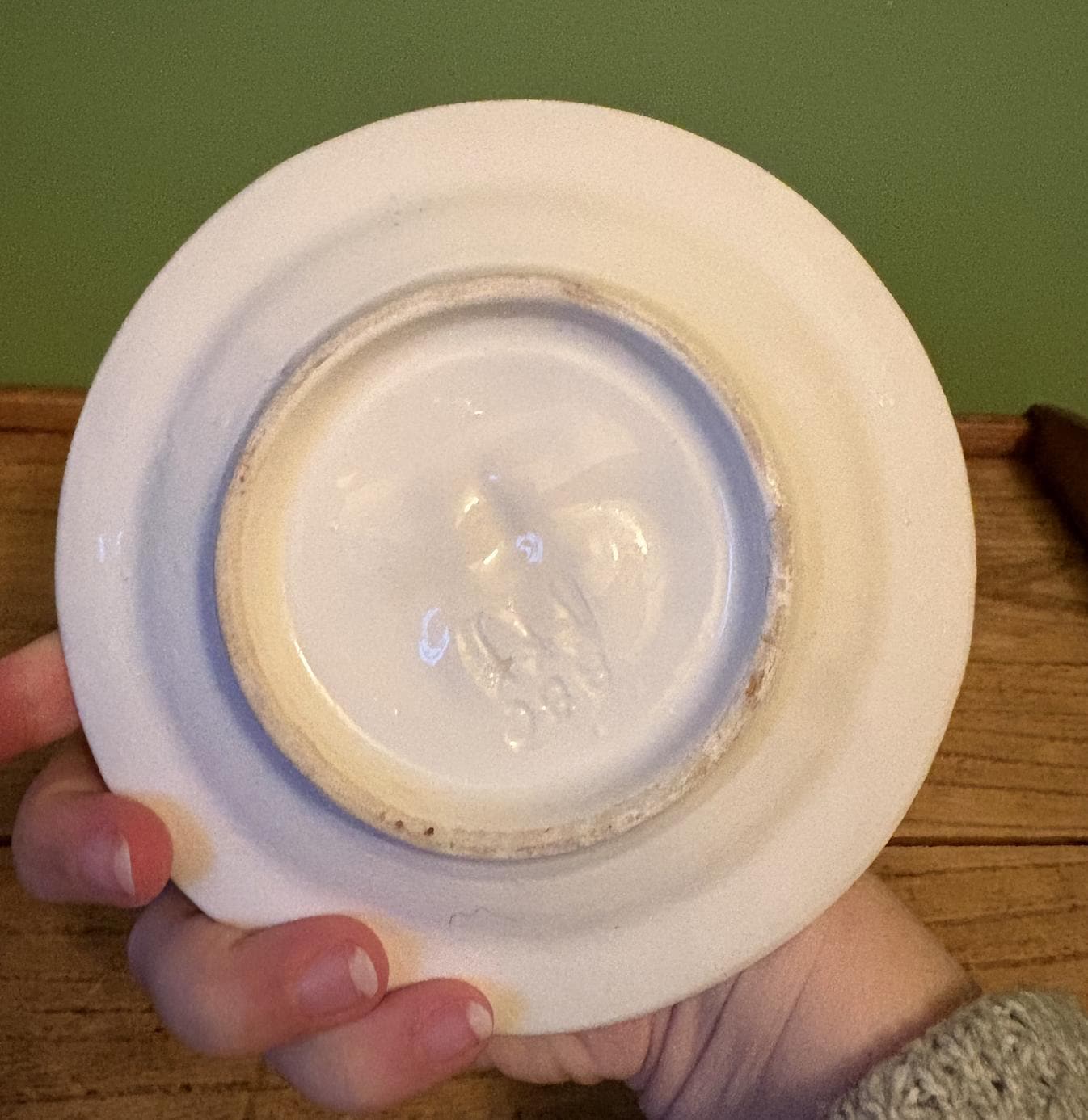 White Ceramic Dish Featuring 3-D Sun Motif