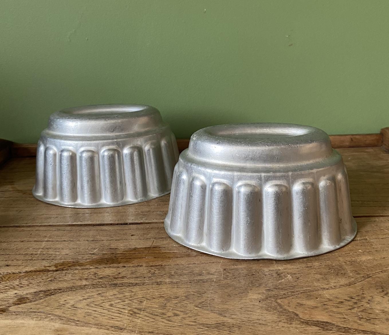 Two Oval Ribbed Aluminium Jelly Moulds