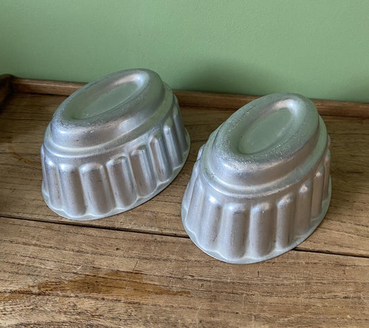 Two Oval Ribbed Aluminium Jelly Moulds
