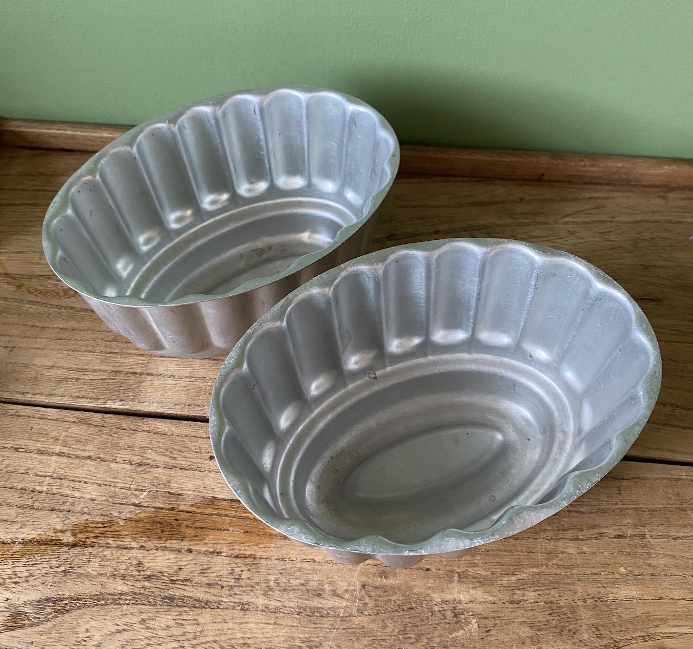 Two Oval Ribbed Aluminium Jelly Moulds