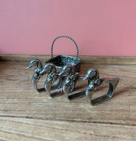 Set of 4 Silver Plate Good Napkin Rings in basket