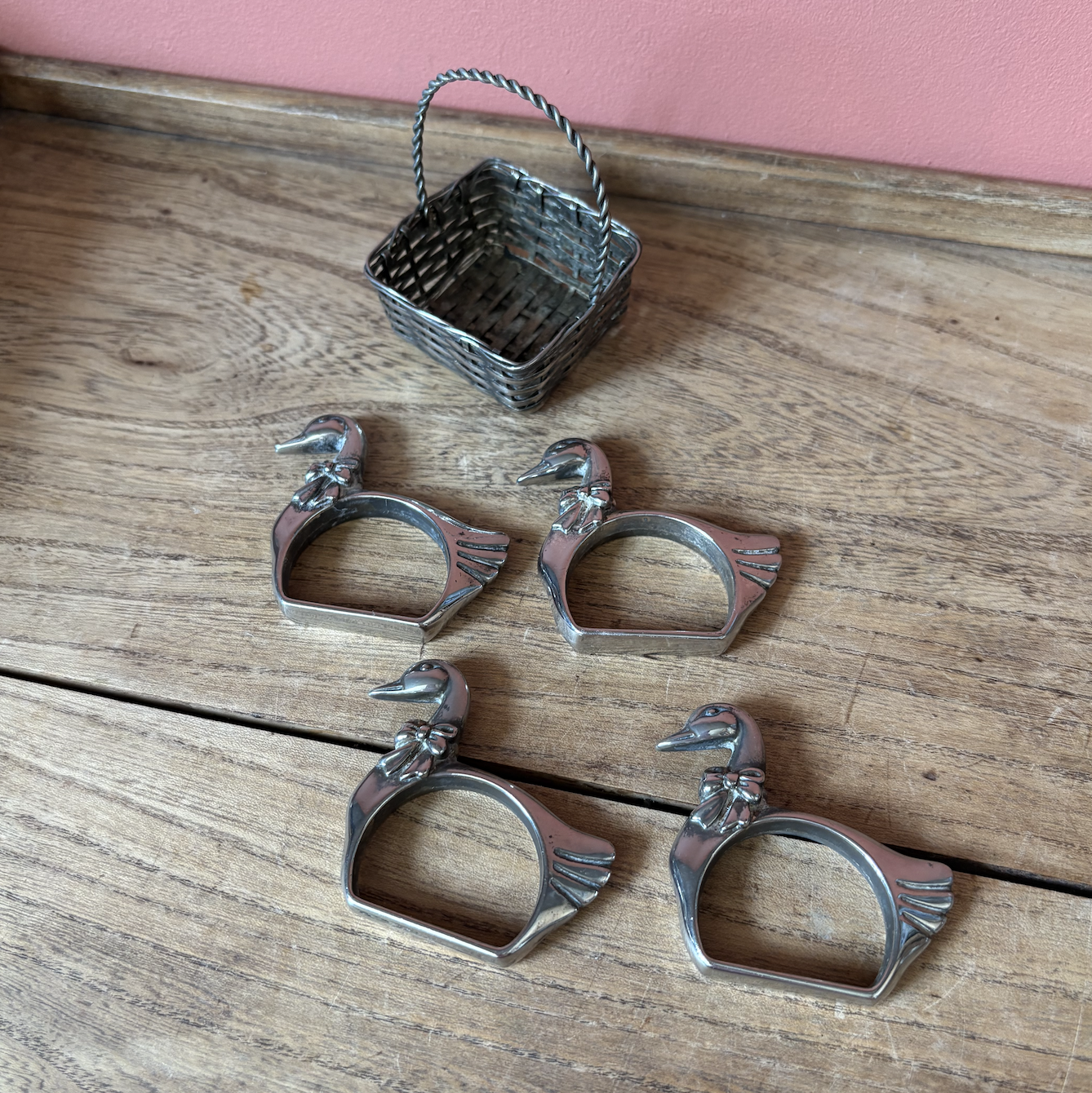 Set of 4 Silver Plate Good Napkin Rings in basket