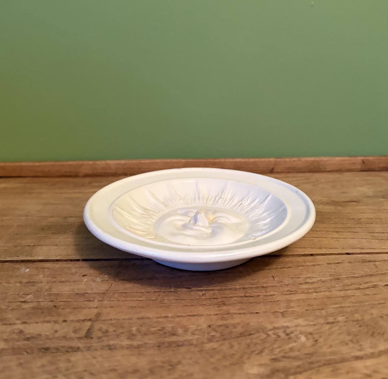 White Ceramic Dish Featuring 3-D Sun Motif