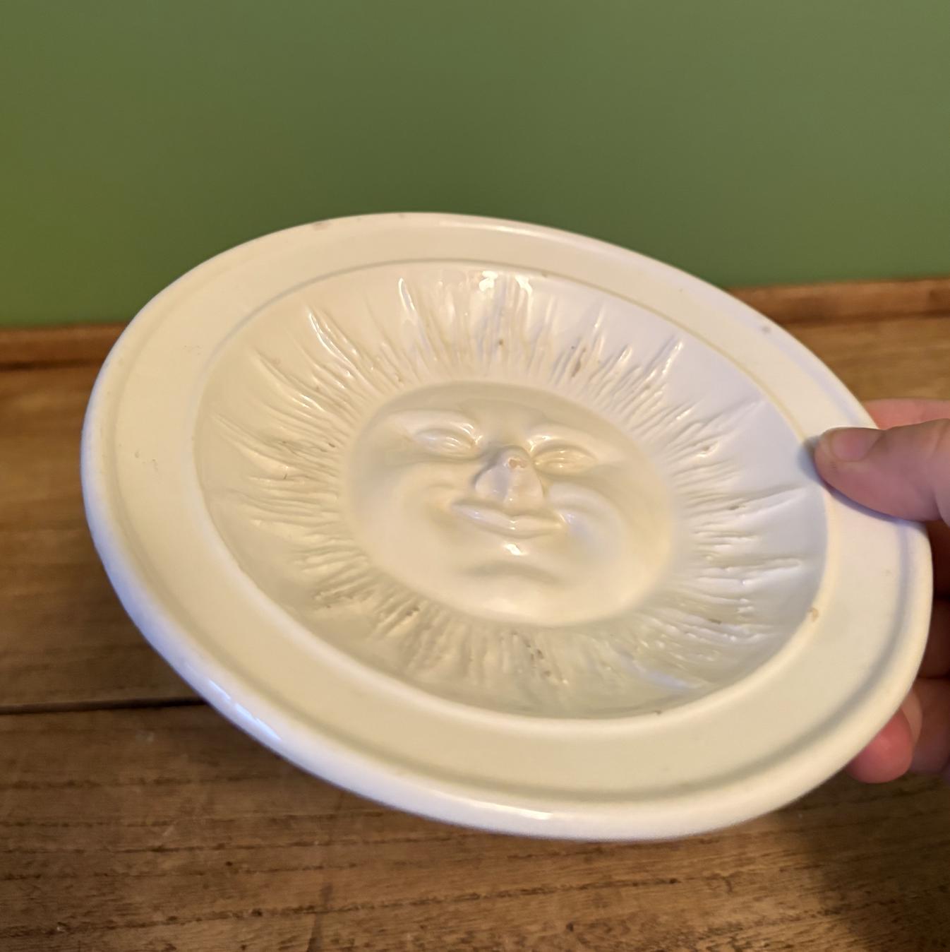 White Ceramic Dish Featuring 3-D Sun Motif