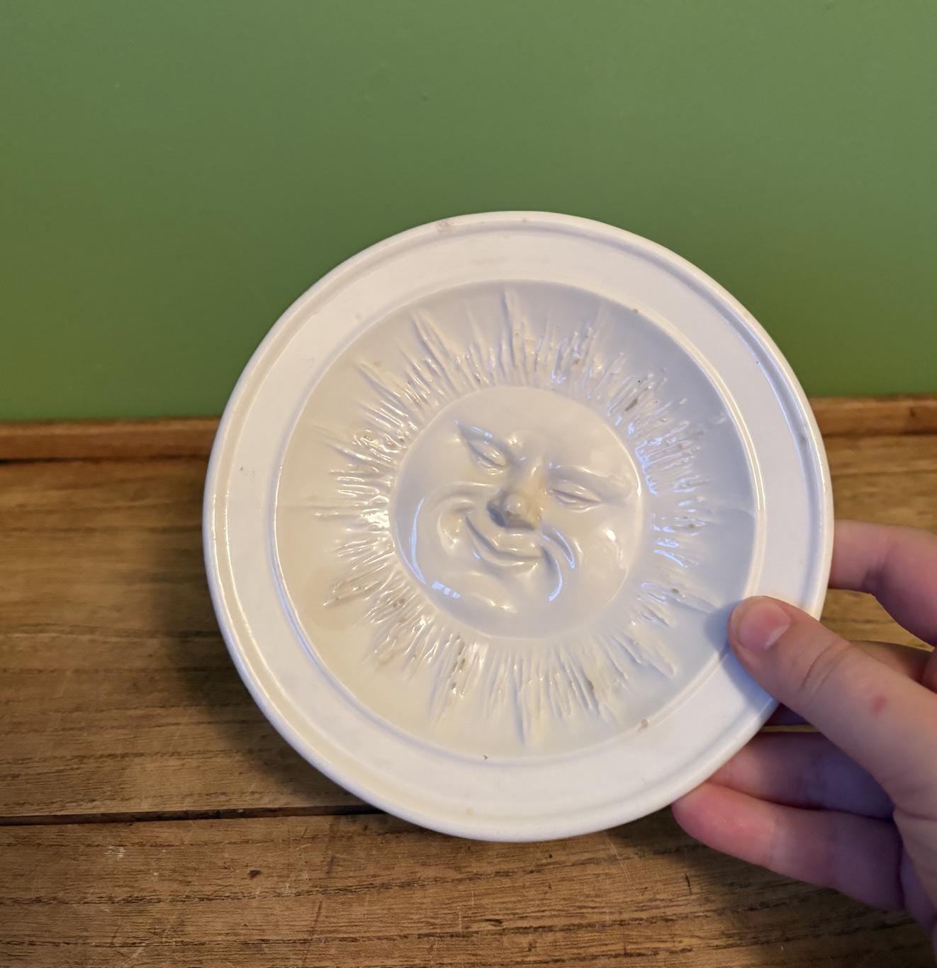 White Ceramic Dish Featuring 3-D Sun Motif